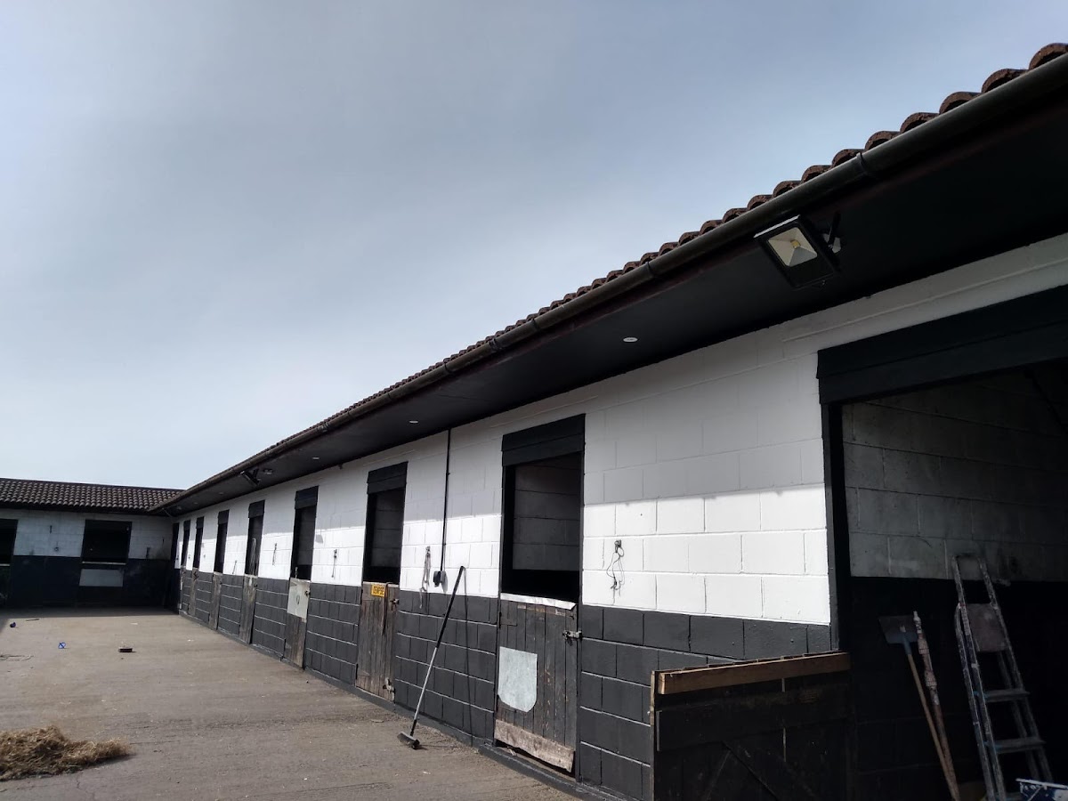 Stable block painted in black and white, exterior