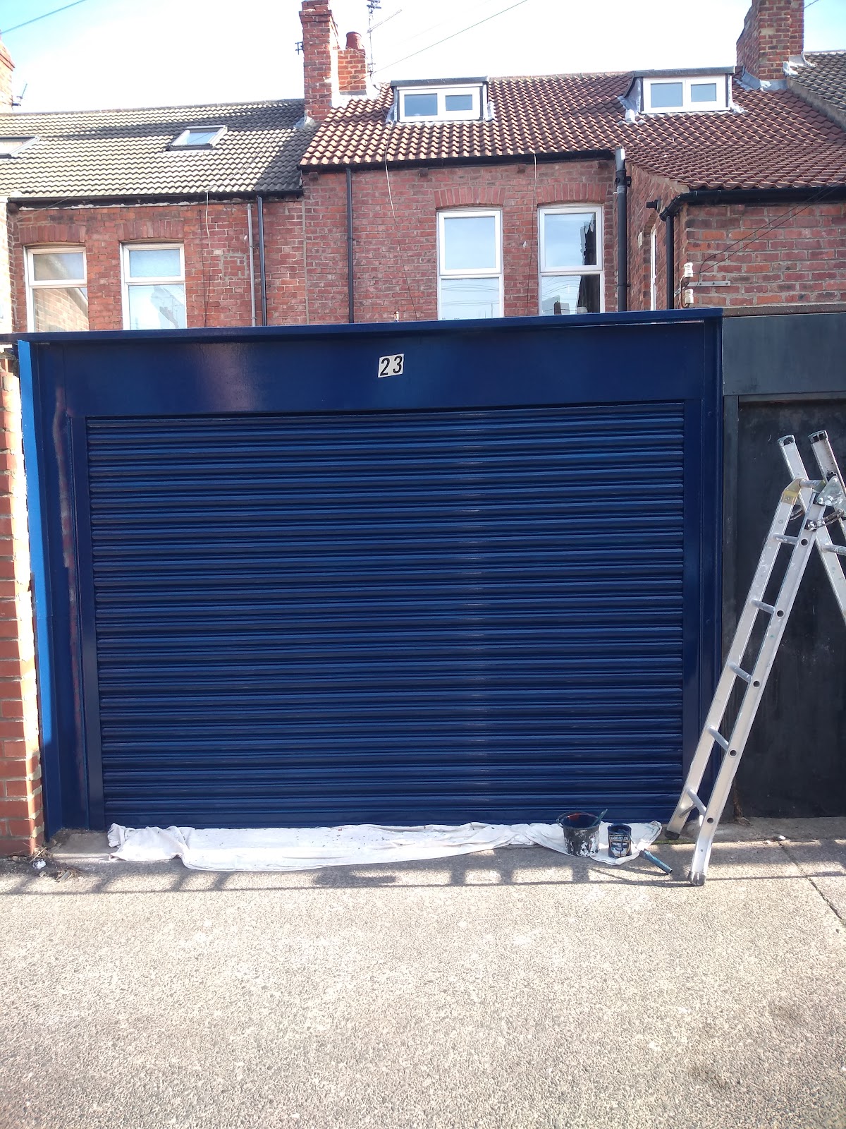 Garage door finished in deep navy